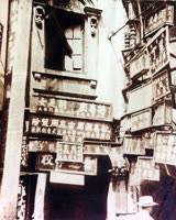 A lilong entrance, papered in nameplates